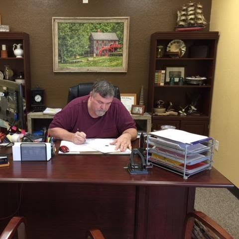 Robert O'Connor working at his desk in the CEO Accounting Service office